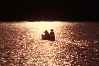 Canoeing Blue Lake, California Couple canoeing into the sunset on Blue Lake, Northern California