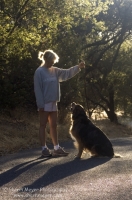 Rural Auburn, California  Woman walking with her dog down a country road, Auburn California