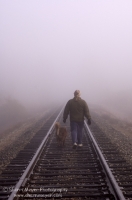 Rural Auburn, California  Man and his dog walking along the railroad tracks, Auburn California