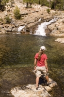 Hiker, Canyon Creek, California Hiker exploring a swimming hole on Canyon Creek, Tahoe National Forest, California