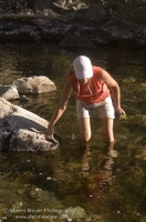 Hiker, Canyon Creek, California Hiker exploring a swimming hole on Canyon Creek, Tahoe National Forest, California