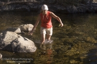 Hiker, Canyon Creek, California Hiker exploring a swimming hole on Canyon Creek, Tahoe National Forest, California