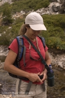 Lake Faucherie, California Woman hiking along Canyon Creek, Tahoe National Forest, California