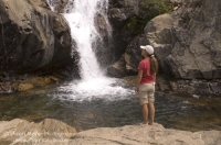 Hiker, Canyon Creek, California Hiker checking out a swimming hole on Canyon Creek, Tahoe National Forest, California