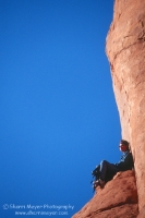 Arches National Park, Utah Hiker resting on a stone throne, in Arches National Park, Utah