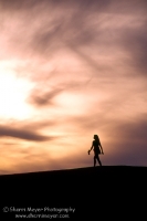 Winemucca Dunes, Winemucca, Nevada  Woman walking across the Winnemucca Sand Dunes, Nevada