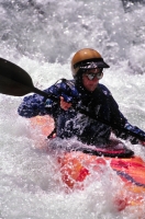 Woman Kayaking the Yuba River, California Woman kayaking on the Yuba River, Nevada County, California
