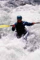 Woman Kayaking the Yuba River, California Woman kayaking on the Yuba River, Nevada County, California