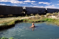 Trego Hot Spring, Nevada Woman soaking in Trego Hot Ditch, Black Rock Desert, Nevada