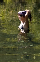 Lake Clementine, Auburn, California Woman cooling off in Lake Clementine on a hot summer  Woman cooling off in Lake Clementine on a hot summer day, Auburn, California