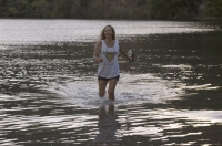 Lake Clementine, Auburn, California  Woman playing in Lake Clementine on a hot summer day, Auburn, California