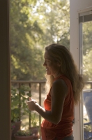Rural Auburn, California  Woman enjoying a summer morning on the deck, Auburn, California