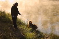 D-OL-03-08  Man and his dog enjoying the Deschutes River, La Pine State Park, Oregon