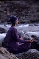 Woman meditating along the American River, Auburn, California Woman meditating by the American River, Auburn, California