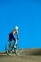 Mountain Biking in Moab, Utah  Woman mountain biking the Slick Rock Trail in Moab, Utah