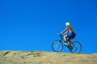 Mountain Biking in Moab, Utah  Woman mountain biking the Slick Rock Trail in Moab, Utah