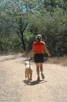 Woman and dog running, Auburn, California Woman running with her dog on the Stagecoach Trail, Auburn, California