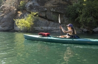 Woman kayaking Lake Clementine, Auburn, California Woman kayaking Lake Clementine, Auburn, California