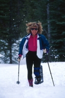 Woman shoeshoeing, Clair Tappaan Lodge, California Woman running in snowshoes, Clair Tappaan Lodge, Soda Springs, California