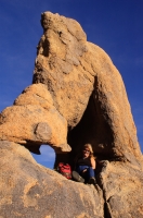 DT-CA-05-12 Woman sitting in an arch, Alabama Hills, Lone Pine, California