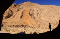 DT-CA-07-11 Man exploring a cave in Cottonwood Canyon, Death Valley National Park, California