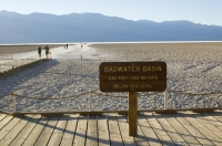 Badwater Basin, Death Valley National Park, California  Badwater Basin sign and visitors walking on the salt flats at Badwater Basin, Death Valley National Park, California