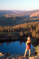 Hiker viewing Island Lake, California Hiker overlooking Island Lake from Grouse Ridge, Tahoe National Forest, California
