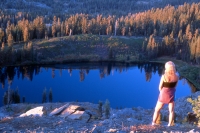 Hiker viewing Island Lake, California Hiker overlooking Island Lake from Grouse Ridge, Tahoe National Forest, California