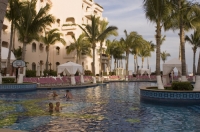 Cabo San Lucas, Mexico Couples enjoying the swimming pool at Pueblo Bonito Rose' Resort, Cabo San Lucas, Baja California, Mexico