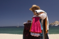 Cabo San Lucas, Mexico Beach vendor walking on the beach (playa), Cabo San Lucas, Baja California, Mexico 