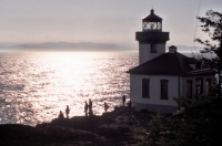 Lighthouse on San Juan Island, Washington Whale watchers & lighthouse in silhouette, San Juan Island, Washington