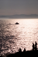 Whale watching from San Juan Island, Washington  Whale watchers in silhouette on San Juan Island, Washington
