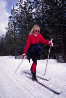 Woman cross country skiing, Foresthill, California  Cross country skiing at China Wall, near Foresthill, California