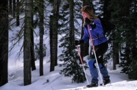 Woman cross country skiing, Castle Peak, California Cross country skiing at Castle Peak, California